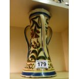 Arts & Crafts terra cotta triple handled vase, in the style of Torquay ware, profusely decorated