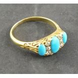 A turquoise and diamond set dress ring, set in a gold band, 4.5g