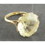 A citrine dress ring, the large faceted stone claw set in a 9ct band, 8g