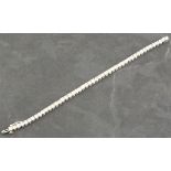 A diamond line bracelet, the round brilliant cut stones approx 9.25ct, claw set in 14ct white