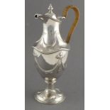 An impressive silver wine ewer, Henry Stratford, London 1897, decorated with repousse swaggs & bows,