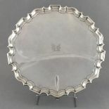 A silver salver Henry Stratford, London 1901, of circular form with a pie-crust border-crust on four