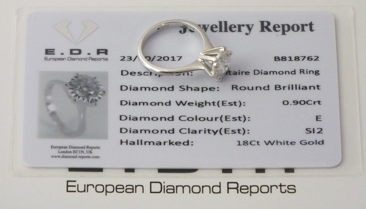 A solitaire diamond ring, the stone approx 0.9ct, 3.7g, together with a European Diamond Reports - Image 2 of 2