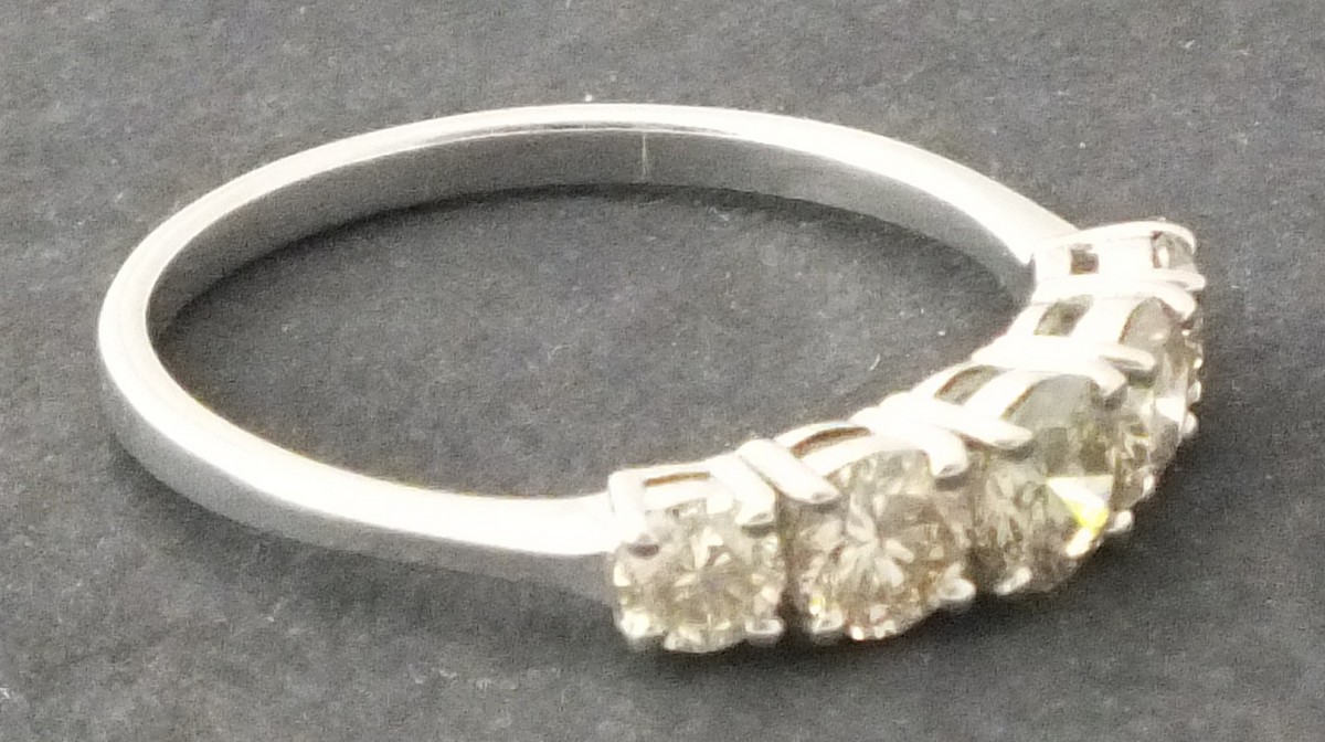 A five stone diamond ring, claw set within 18ct white gold, 2.4g