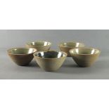 Leach Pottery - Five Leach Standard Ware earthenware bowls with celadon glaze, Impressed potter's