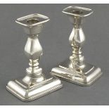 A pair of silver candlesticks Martin Hall & Co, Sheffield 1910, of rectangular baluster form with