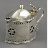 A large silver mustard pot C.S. Harris, London 1908, of faceted rectangular form with pierced floral