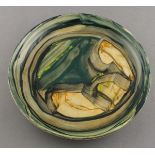 Reginald James LLOYD (British b.1926) ceramic plate decorated in green, orange, yellow & black