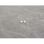 A pair of diamond ear studs, the central stone within a further band of diamonds, 1.4g