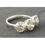 A three stone diamond dress ring, claw set in platinum, 5.55ct total weight, 7.4g