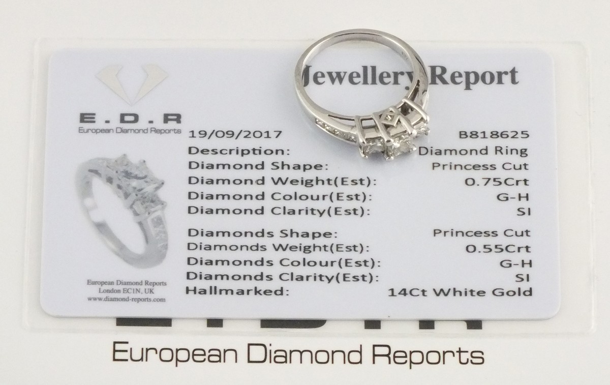 A three stone diamond dress ring, the claw set stones approx 1.3ct total weight, set in 14ct white - Image 2 of 2