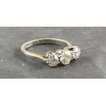 A three stone diamond ring, approx. 1.5ct total, claw set in an 18ct white gold band, 4g