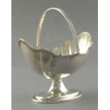 A silver swing handle sugar basket, London 1898 - Thomas Bradbury, of oval form with a shaped reeded