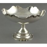 A plain silver tazza, London 1903, the bowl with a shaped foliate rim and raised on a circular base,