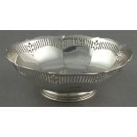 A silver fruit bowl, Sheffield 1925 - James Dixon & Sons, of faceted circular form with a slotted
