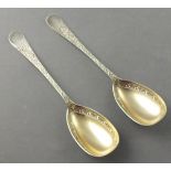 A pair of Victorian parcel gilt serving spoons, London 1878 - Robert Hutton, the bright-cut