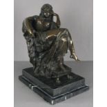 20th Century Bronze Sculpture, a seated nude, draped in fabric, feet raised on a stool mounted on