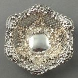 A silver bon bon dish, Chester 1896 - H. Mathews, pierced and with repousse decoration of garlands