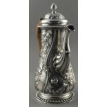 A George II silver coffee pot, London 1757, of bellied form with extensive foliate decoration and