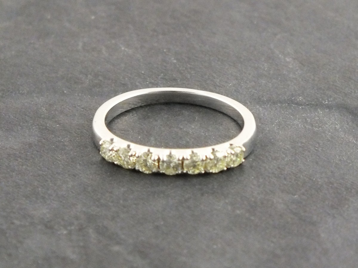 A diamond half hoop eternity ring, set in 9ct white gold, 1g