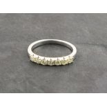 A diamond half hoop eternity ring, set in 9ct white gold, 1g
