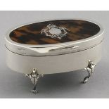 A tortoiseshell and silver mounted jewellery box, the hinged cover with piquet work cartouch, raised