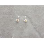A pair of diamond ear studs, the claw set stones 0.30ct, 0.5g