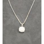A diamond cluster pendent, the stones set in an 18ct white gold frame, on a fine silver chain, 2.6g