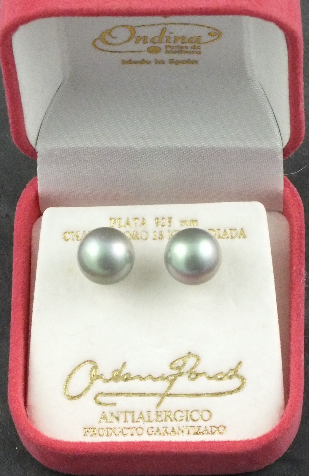 A pair of iridescent pearl ear studs