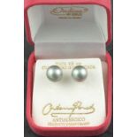 A pair of iridescent pearl ear studs