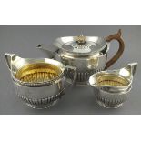 A three piece silver tea service, London 1806, Richard Cook, part garooned and engraved with