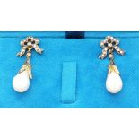 A pair of pearl and diamond drop ear pendents, the pearls suspended from bows