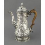 A George II silver coffee pot, London 1757, profusely decorated with flowers and foliage,  917g.