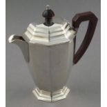 An Art Deco silver hot water jug, Birmingham 1937, Adie Bros., of plain octagonal form, 8.25" (21cm)