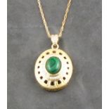 A 9ct malachite and diamond pendent, the oval cabochon stone within a diamond band set in an open