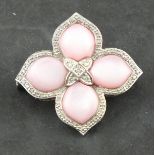 A pink abolone and diamond set brooch, of foliate form set in 18ct white gold 7.2g