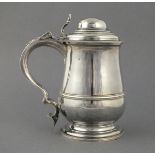 A Georgian silver lidded tankard, London 1764, William Cripps, the domed lid above a baluster shaped