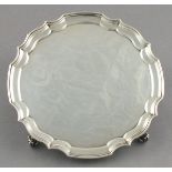 A silver salver, Birmingham 1968, J B Catterley & Sons, of circular ogee form, raised on four scroll