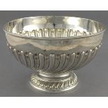 A Victorian silver punch bowl, London 1900, Wakely & Wheeler, part gadrooned and raised on a