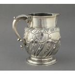 SILVER WITHDRAWN - A Georgian silver ale jug, London 1762, part gadrooned  with foliate repousse and