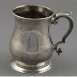 A Georgian silver baluster mug, London 1743, Henry Payne, with C-scroll handles and raised on a