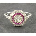 An art deco style ruby and diamond dress ring, the octagonal setting mounted on an 19ct white gold