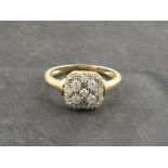 A square cluster diamond ring, set within a 9ct gold band, 2.6g