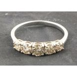 A diamond five stone ring, the graduated stones claw set in an 18ct white gold band, total 1.04ct,