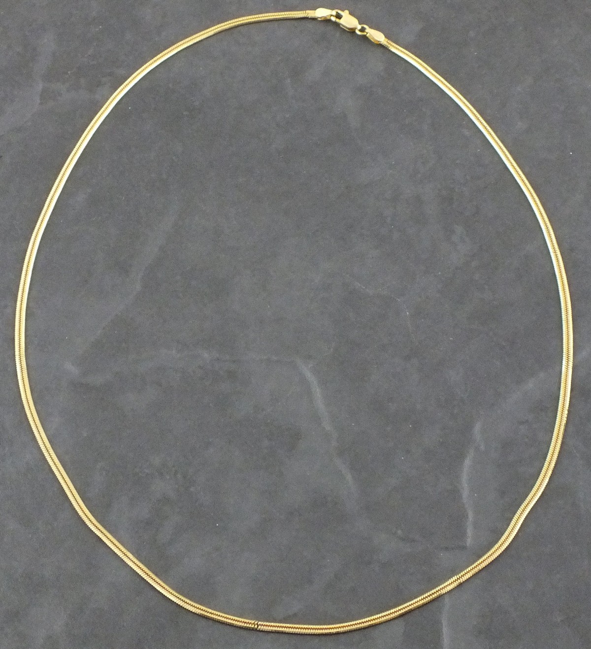 An 18ct gold chain, of a fine chevron pattern, 12.8g