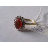 18ct gold ring set with an oval fire opal & diamond surround. Approx size 'O'