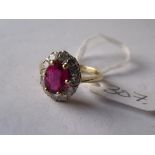 A GOOD 18CT GOLD MOUNTED RUBY & diamond cluster ring approx 'M'