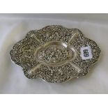 Foreign shaped oval pin tray decorated with putti 8” wide 120g