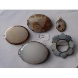 Bag containing five agate brooches