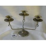 A three light candelabrum circular base Decorated shell motifs 8” wide 800 standard